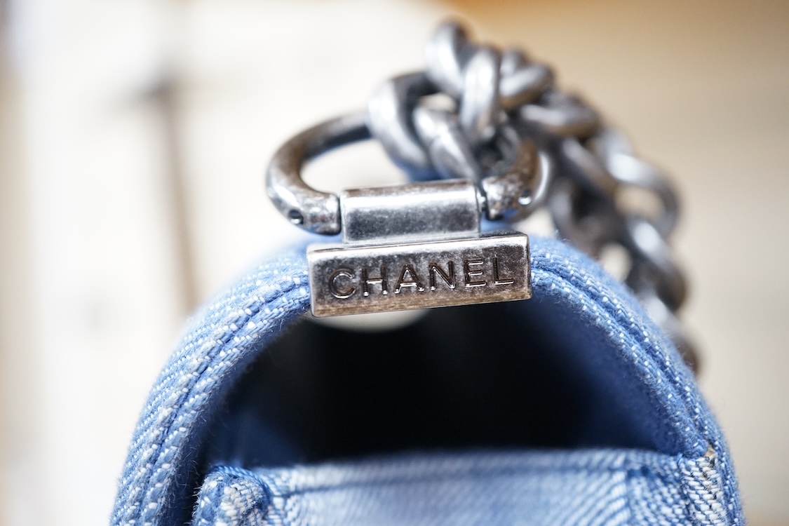 A Chanel denim cheveron flap shoulder bag with silver hardware, date code 20845697, 28cm wide